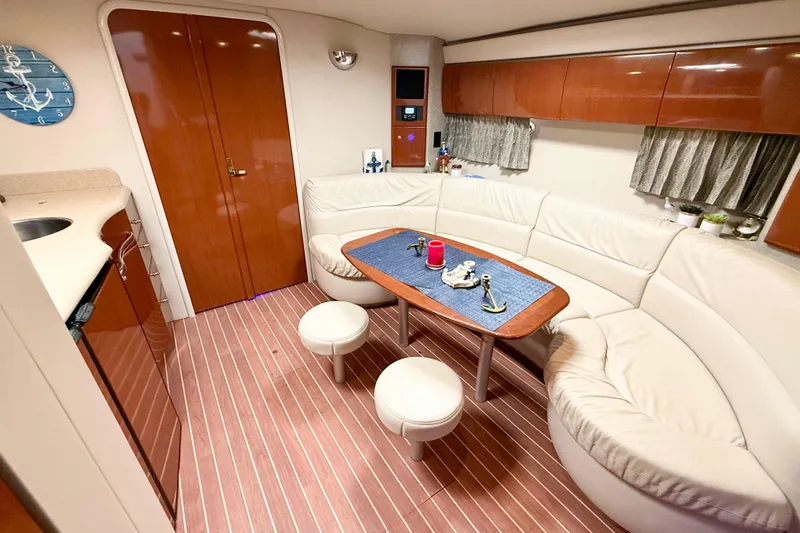 Yachtsea Yacht Photos Pics 2004 Formula 40 Performance Cruiser interior with elegant seating and wooden accents.
