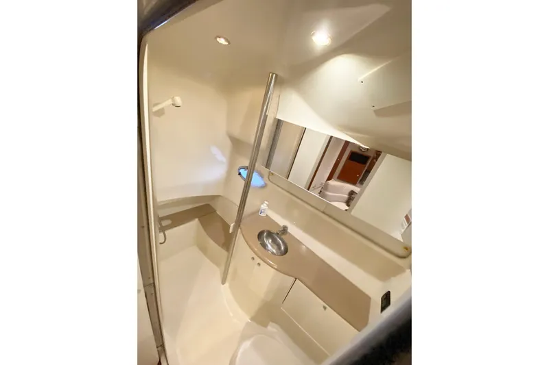 Yachtsea Yacht Photos Pics 2004 Formula 40 Performance Cruiser bathroom interior with sink and mirror.