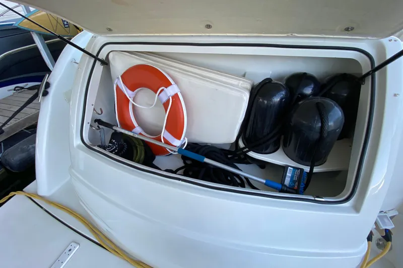 Yachtsea Yacht Photos Pics Storage compartment of 2004 Formula 40 Performance Cruiser with life ring and fenders.