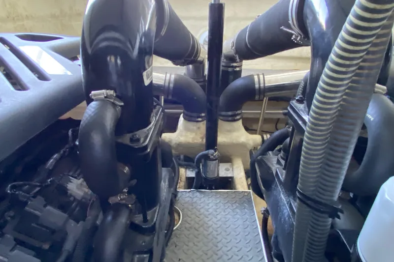 Yachtsea Yacht Photos Pics Engine compartment of a 2004 Formula 40 Performance Cruiser with visible hoses and components.