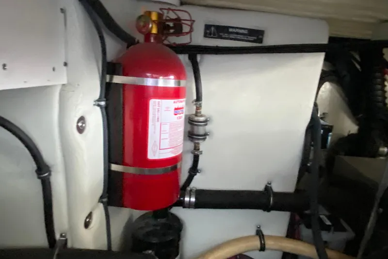 Yachtsea Yacht Photos Pics Engine room of 2004 Formula 40 Performance Cruiser with mounted fire extinguisher.