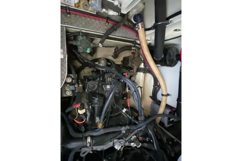 Yachtsea Yacht Photos Pics Engine compartment of a 2004 Formula 40 Performance Cruiser with visible hoses and components.