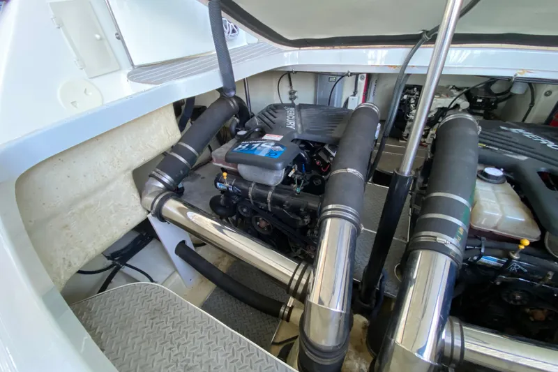 Yachtsea Yacht Photos Pics Engine compartment of a 2004 Formula 40 Performance Cruiser with visible components and piping.