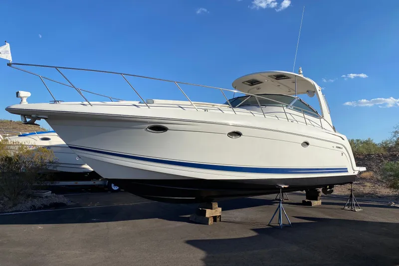 Yachtsea Yacht Photos Pics 2004 Formula 40 Performance Cruiser boat on stands under clear blue sky.