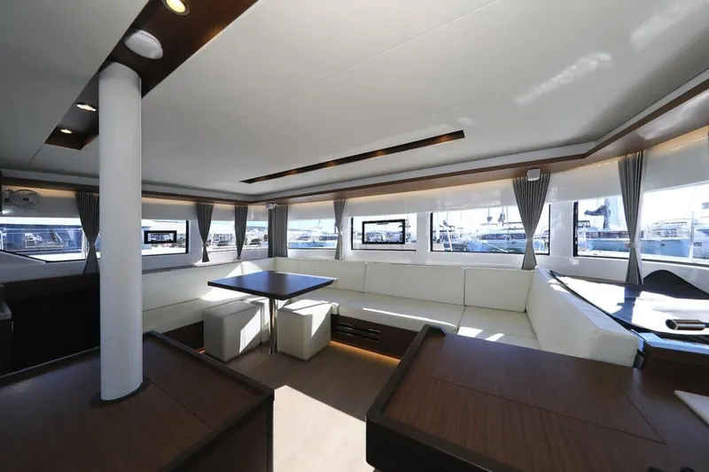  Yacht Photos Pics Spacious interior of 2021 Lagoon 50 catamaran with modern furnishings and large windows.