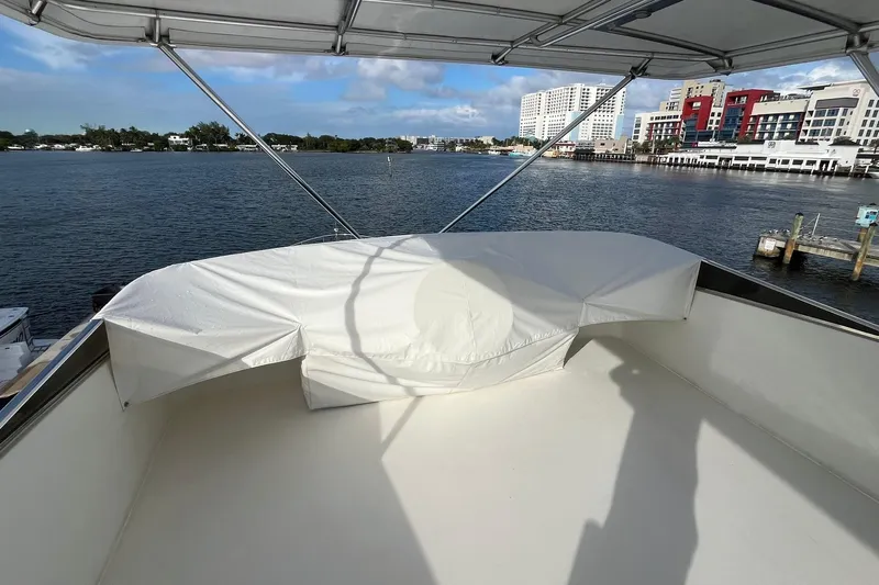 Atlantis Yacht Photos Pics 1996 Hershine Benship 87 yacht deck with waterfront cityscape view.