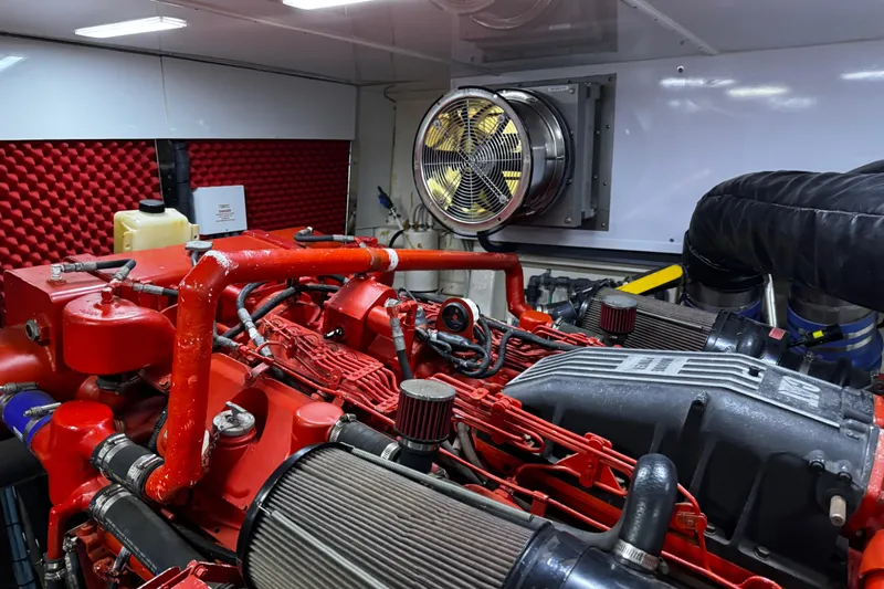 Atlantis Yacht Photos Pics Engine room of 1996 Hershine Benship 87 yacht with red machinery and ventilation system.