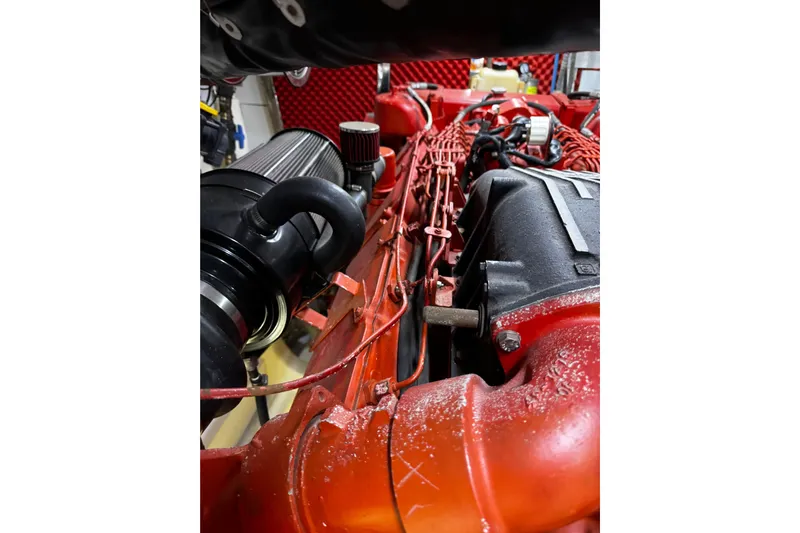 Atlantis Yacht Photos Pics Engine of 1996 Hershine Benship 87, showcasing intricate red components and filters.