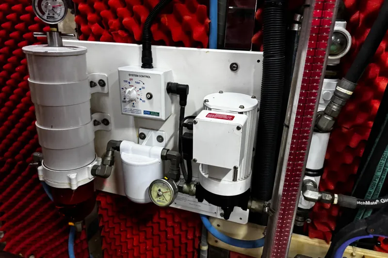 Atlantis Yacht Photos Pics Engine room equipment of 1996 Hershine Benship 87 with control panel and gauges.