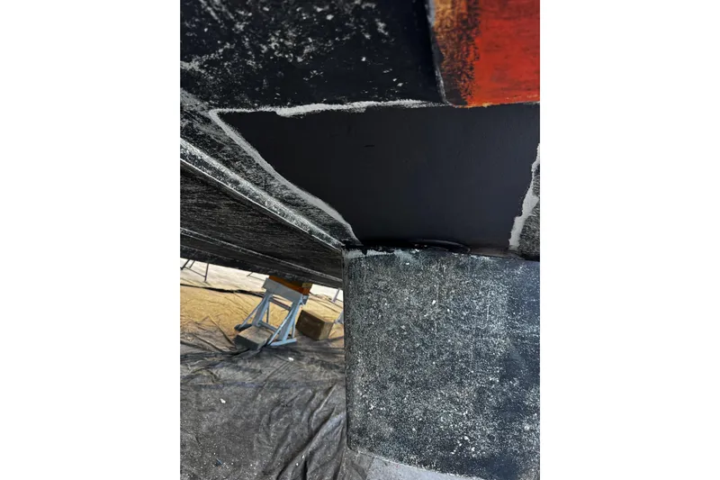 Atlantis Yacht Photos Pics Bottom view of 1996 Hershine Benship 87 boat hull on stands.