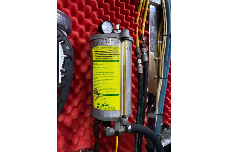 Atlantis Yacht Photos Pics Hydraulic system reservoir on Hershine Benship 87, 1996 model, with red foam background.