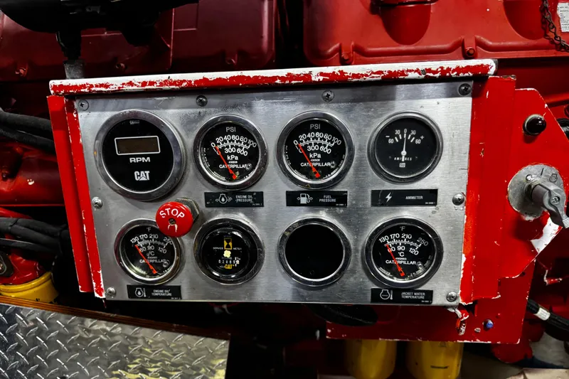 Atlantis Yacht Photos Pics Control panel of a 1996 Hershine Benship 87 with gauges and indicators.