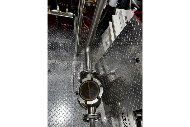 Atlantis Yacht Photos Pics Engine room of 1996 Hershine Benship 87 with metal flooring and piping.