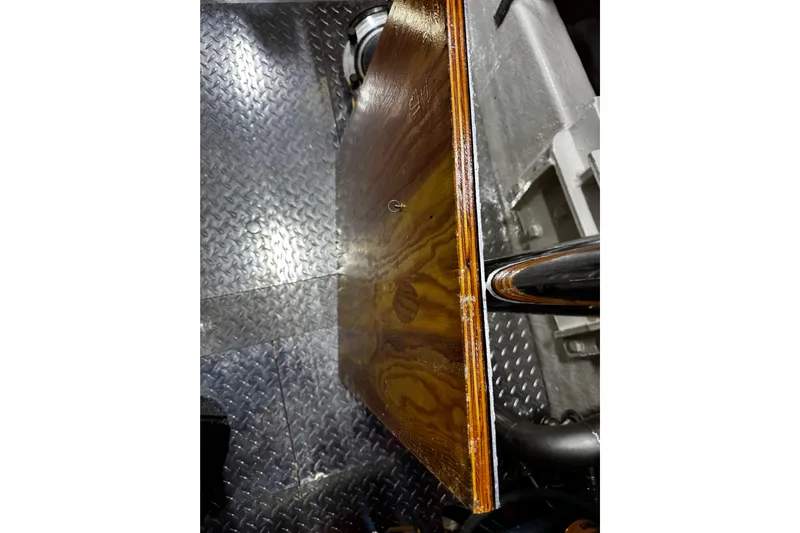 Atlantis Yacht Photos Pics Engine room of 1996 Hershine Benship 87 with wooden panel and metal flooring.