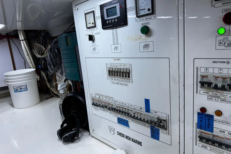 Atlantis Yacht Photos Pics Electrical control panel on 1996 Hershine Benship 87 yacht, featuring various switches and wiring.