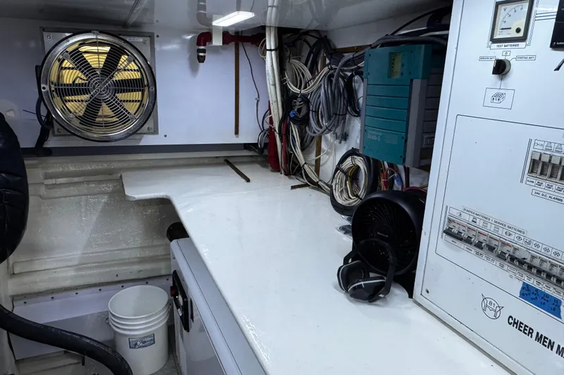 Atlantis Yacht Photos Pics Engine room of 1996 Hershine Benship 87 with control panel and ventilation fan.