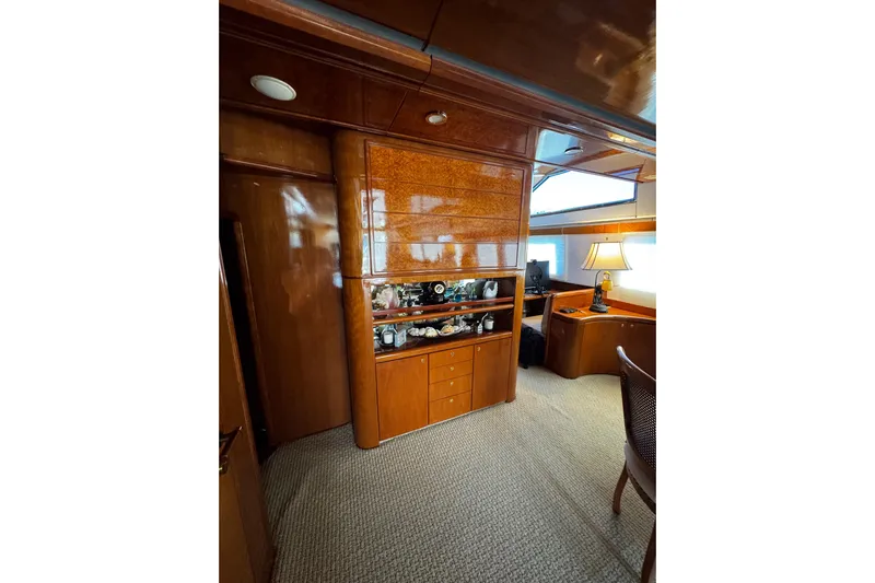 Atlantis Yacht Photos Pics Luxurious interior of 1996 Hershine Benship 87 yacht with wooden cabinetry and elegant decor.