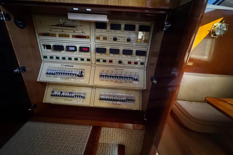 Atlantis Yacht Photos Pics Control panel of a 1996 Hershine Benship 87 yacht, featuring various switches and displays.