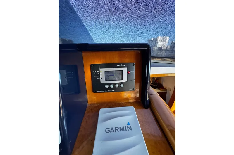 Atlantis Yacht Photos Pics Control panel and Garmin device on 1996 Hershine Benship 87 yacht dashboard.