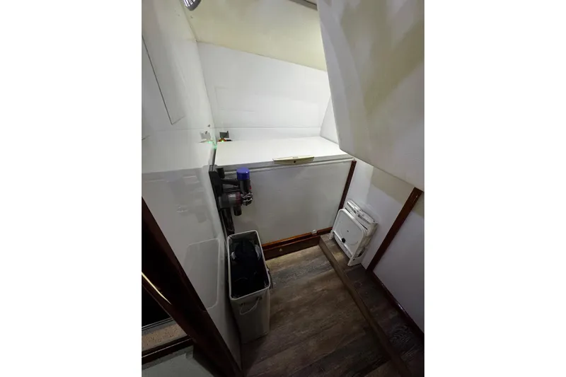 Atlantis Yacht Photos Pics Interior of 1996 Hershine Benship 87 yacht, featuring storage and utility area.