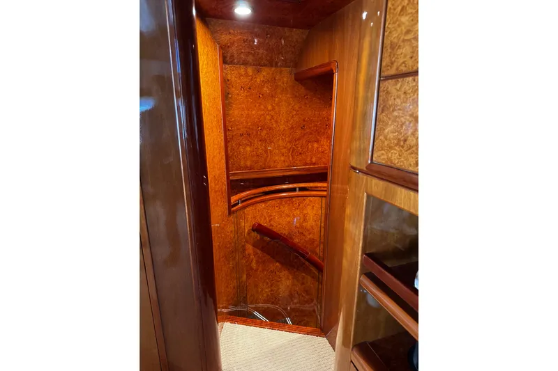 Atlantis Yacht Photos Pics Luxurious wooden interior of 1996 Hershine Benship 87 yacht staircase.
