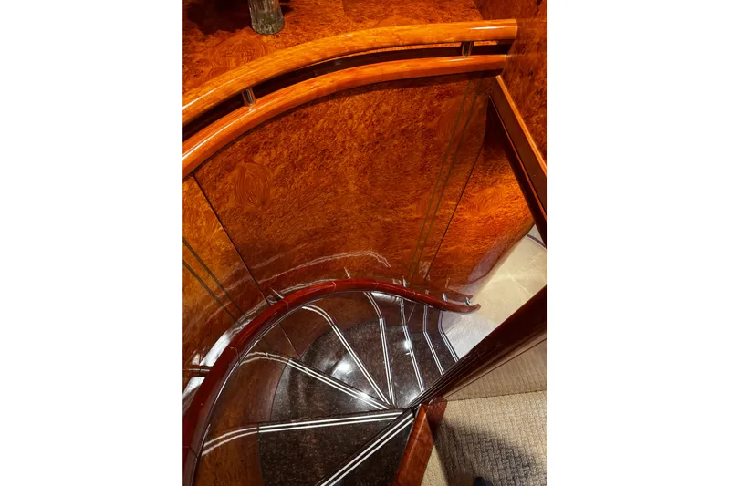 Atlantis Yacht Photos Pics Luxurious wooden staircase on 1996 Hershine Benship 87 yacht interior.