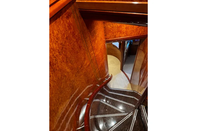 Atlantis Yacht Photos Pics Luxurious wooden staircase inside 1996 Hershine Benship 87 yacht.