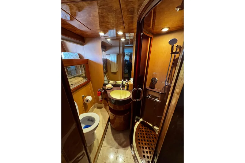 Atlantis Yacht Photos Pics Luxurious bathroom in 1996 Hershine Benship 87 yacht with modern amenities.