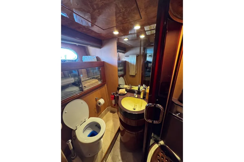 Atlantis Yacht Photos Pics Luxurious bathroom in 1996 Hershine Benship 87 yacht with modern amenities.