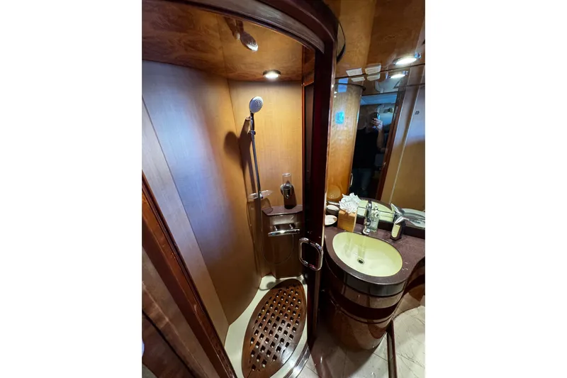 Atlantis Yacht Photos Pics Luxurious bathroom in 1996 Hershine Benship 87 yacht with shower and sink.