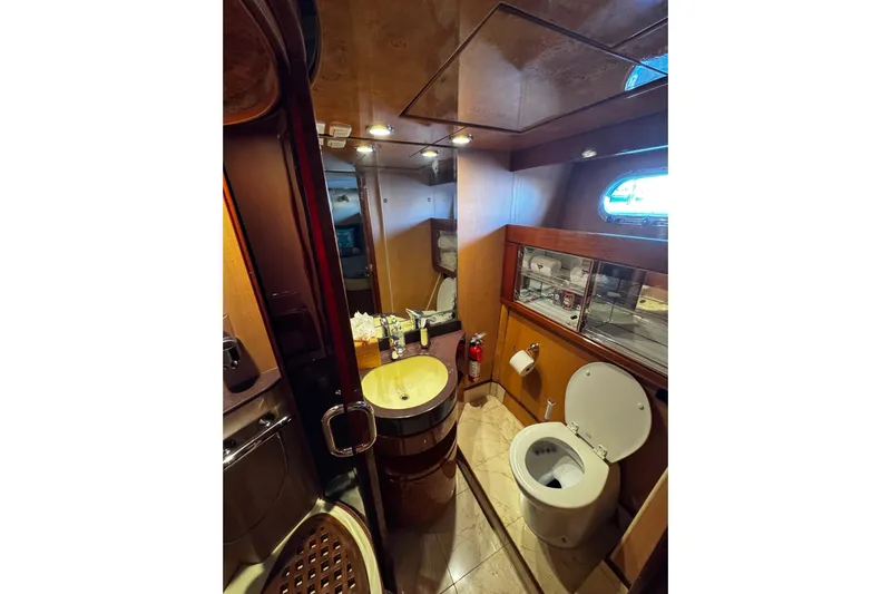 Atlantis Yacht Photos Pics Luxurious bathroom interior of 1996 Hershine Benship 87 yacht with modern amenities.