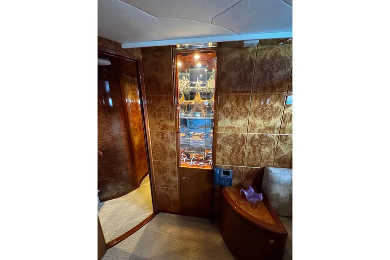 Atlantis Yacht Photos Pics Luxurious interior of 1996 Hershine Benship 87 yacht with elegant wood paneling.