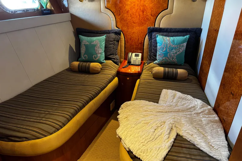 Atlantis Yacht Photos Pics Luxurious twin cabin on 1996 Hershine Benship 87 yacht with elegant decor.