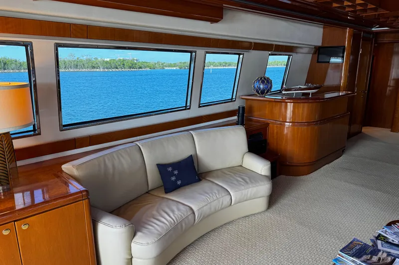 Atlantis Yacht Photos Pics Luxurious interior of 1996 Hershine Benship 87 yacht with scenic ocean view.