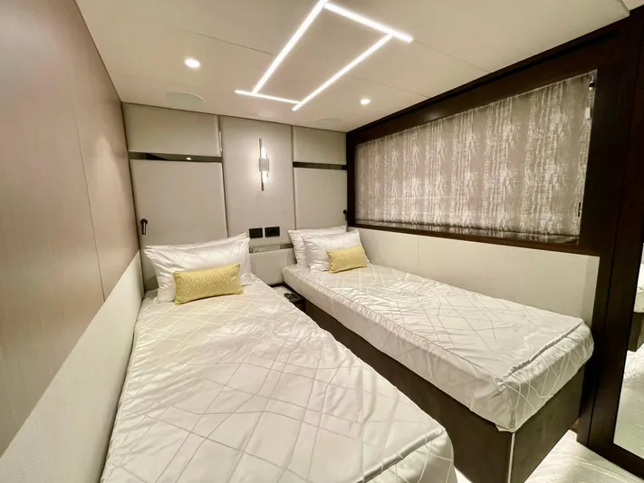  Yacht Photos Pics Luxurious twin bedroom in 2022 Sunseeker 88 Yacht, featuring modern design and elegant lighting.