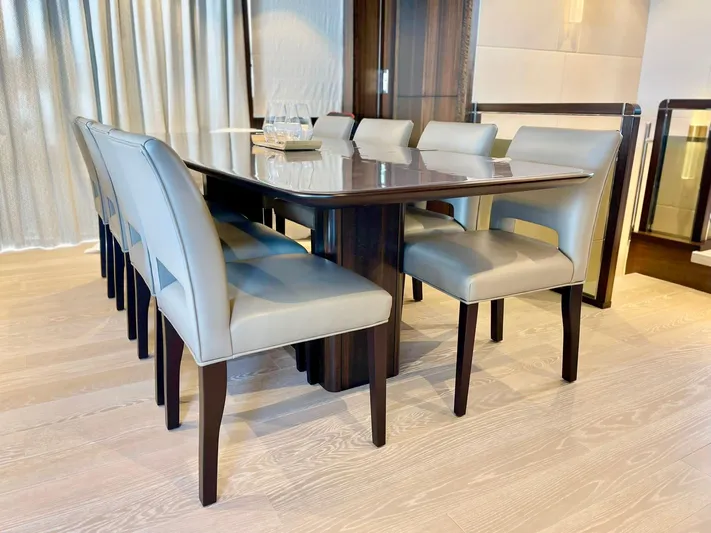  Yacht Photos Pics Luxurious dining area on 2022 Sunseeker 88 Yacht with elegant table and chairs.