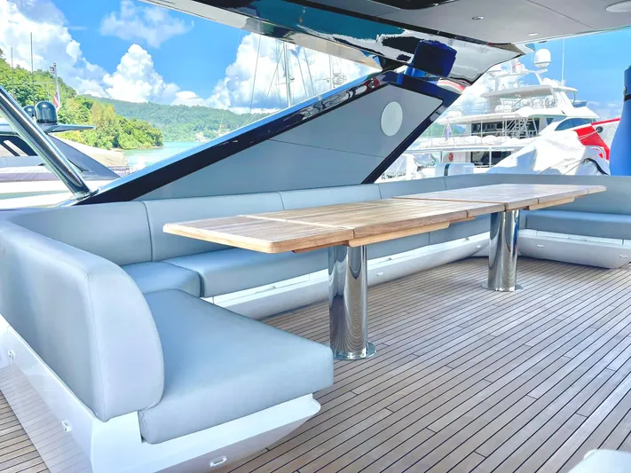  Yacht Photos Pics Luxurious Sunseeker 88 Yacht 2022 with elegant outdoor seating and wooden deck.