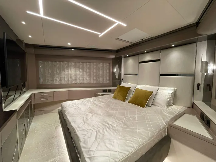  Yacht Photos Pics Luxurious bedroom interior of 2022 Sunseeker 88 Yacht with modern design and elegant lighting.