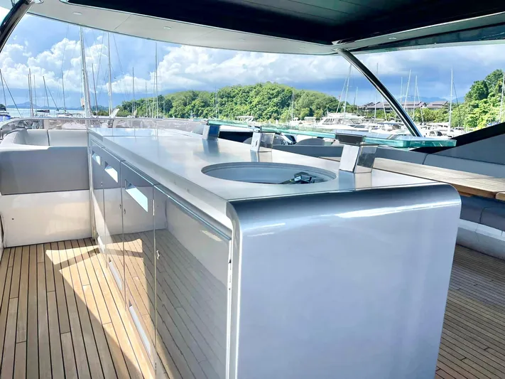  Yacht Photos Pics Luxurious Sunseeker 88 Yacht 2022 with sleek outdoor kitchen and stunning marina view.
