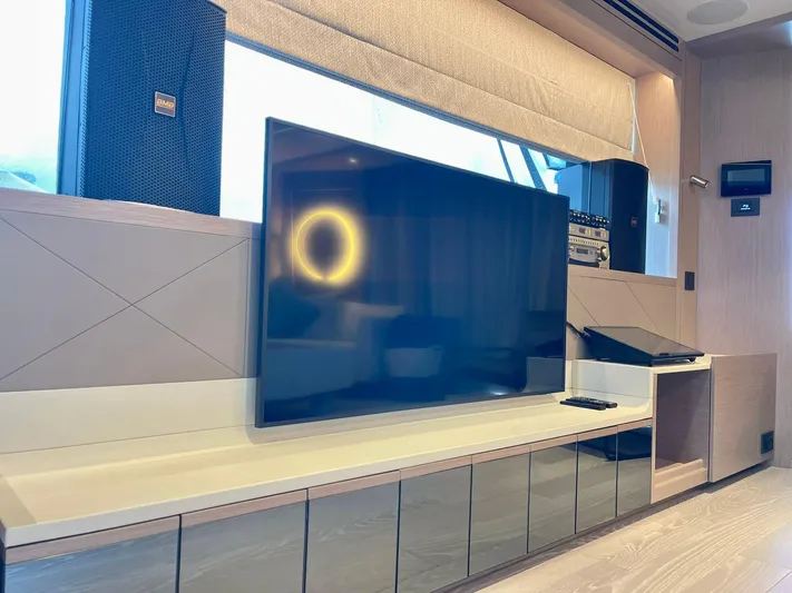  Yacht Photos Pics Luxurious interior of 2022 Sunseeker 88 Yacht featuring modern entertainment system.