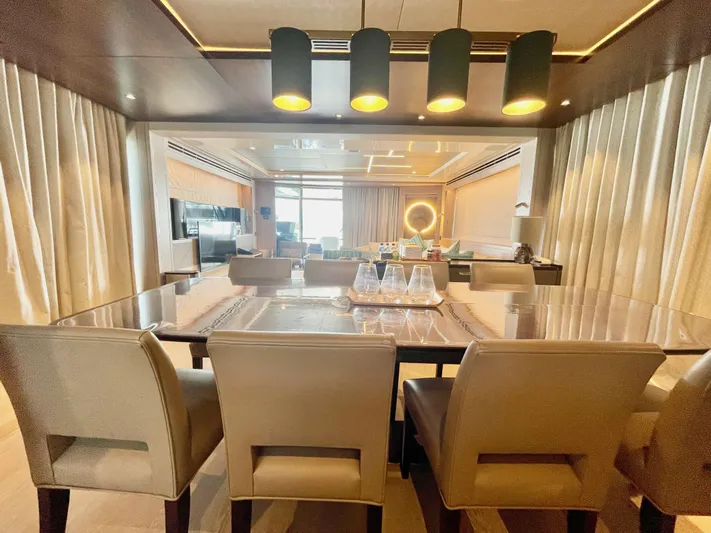  Yacht Photos Pics Luxurious interior of 2022 Sunseeker 88 Yacht with elegant dining area and modern lighting.