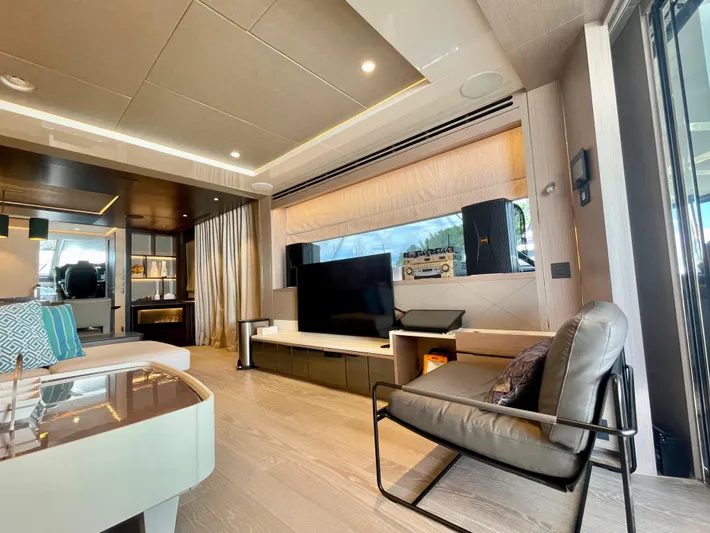  Yacht Photos Pics Luxurious interior of 2022 Sunseeker 88 Yacht with modern furnishings and large windows.
