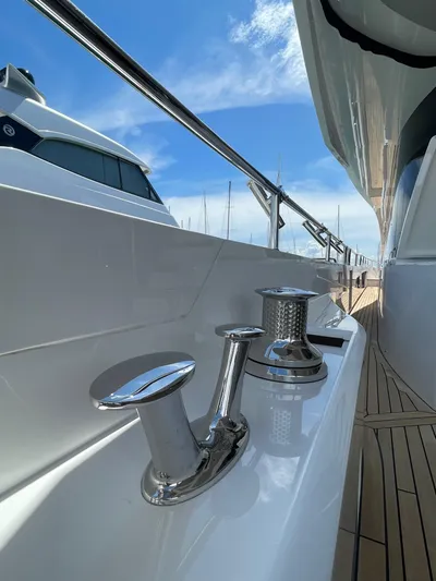  Yacht Photos Pics 2022 Sunseeker 88 Yacht deck with polished cleats and blue sky background.