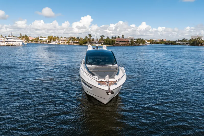 Lorena Yacht Photos Pics 2022 Sunseeker Predator 65 yacht on calm water, clear sky background.