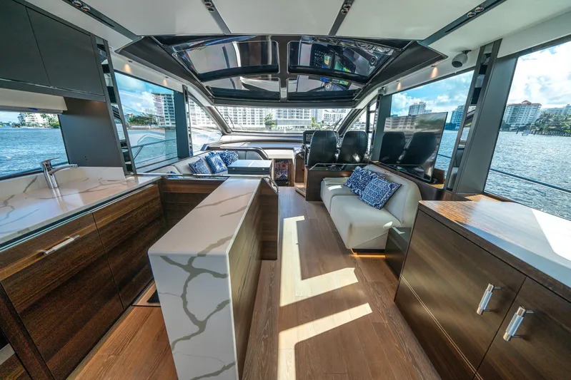 Lorena Yacht Photos Pics Luxurious interior of 2022 Sunseeker Predator 65 yacht with modern design and waterfront view.