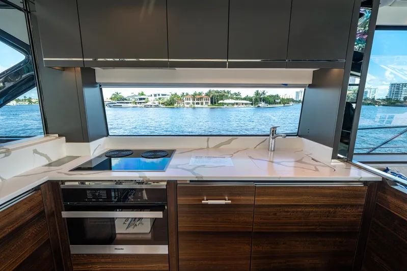 Lorena Yacht Photos Pics Luxurious kitchen interior of 2022 Sunseeker Predator 65 yacht with waterfront view.