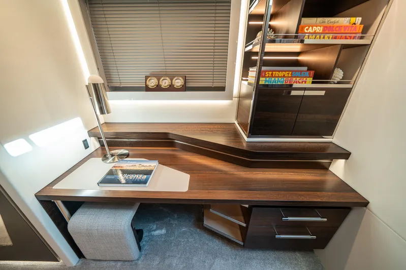 Lorena Yacht Photos Pics Luxurious interior of 2022 Sunseeker Predator 65 yacht with modern desk and shelving.