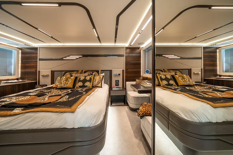 Lorena Yacht Photos Pics Luxurious bedroom interior of 2022 Sunseeker Predator 65 yacht with elegant decor and lighting.
