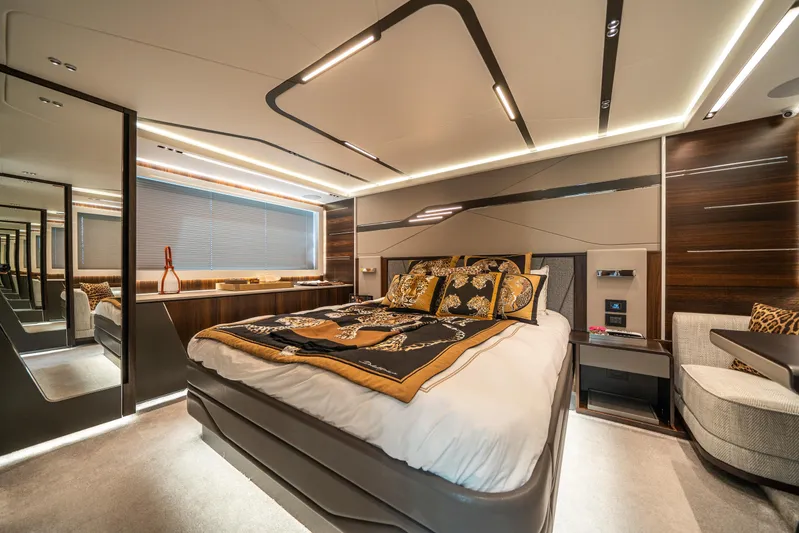 Lorena Yacht Photos Pics Luxurious bedroom interior of 2022 Sunseeker Predator 65 yacht, featuring elegant design and modern amenities.
