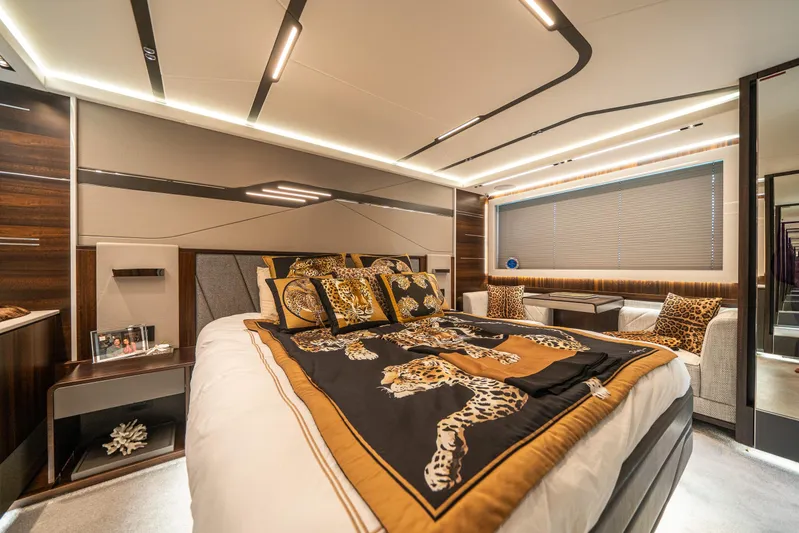 Lorena Yacht Photos Pics Luxurious bedroom interior of 2022 Sunseeker Predator 65 yacht with leopard-themed decor.